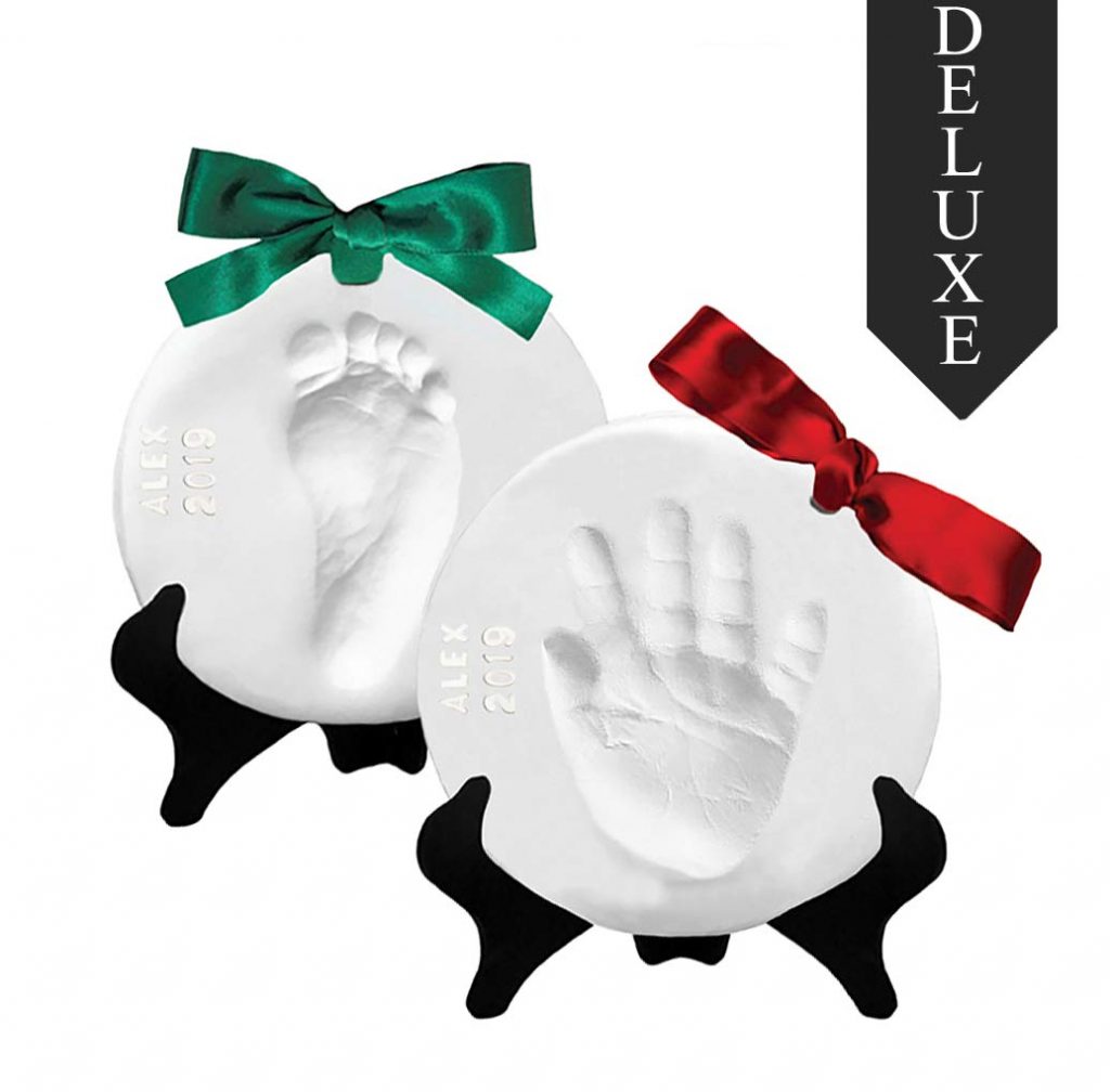 Two Keepsake Ornaments made of clay with baby hand prints with Alex 2019 engraved onto the ornament