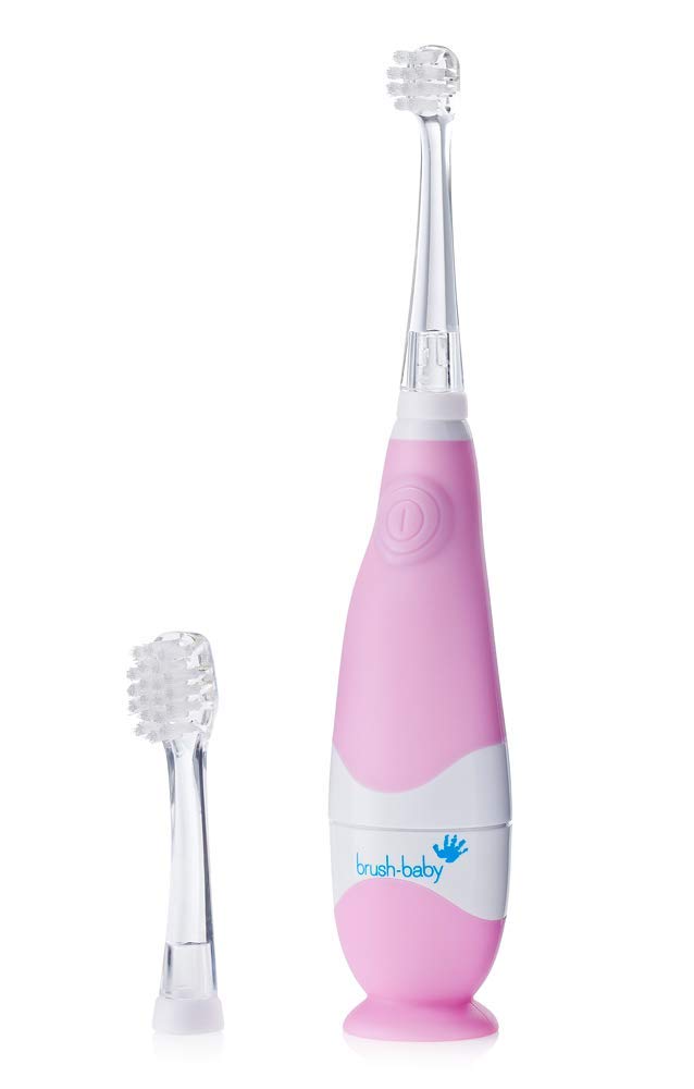 Pink electric toothbrush for kids and extra toothbrush head